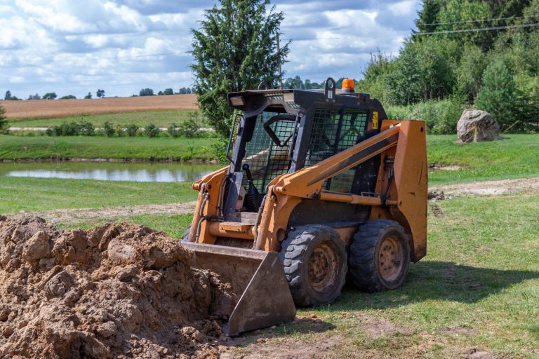 mini excavator being used on rural land