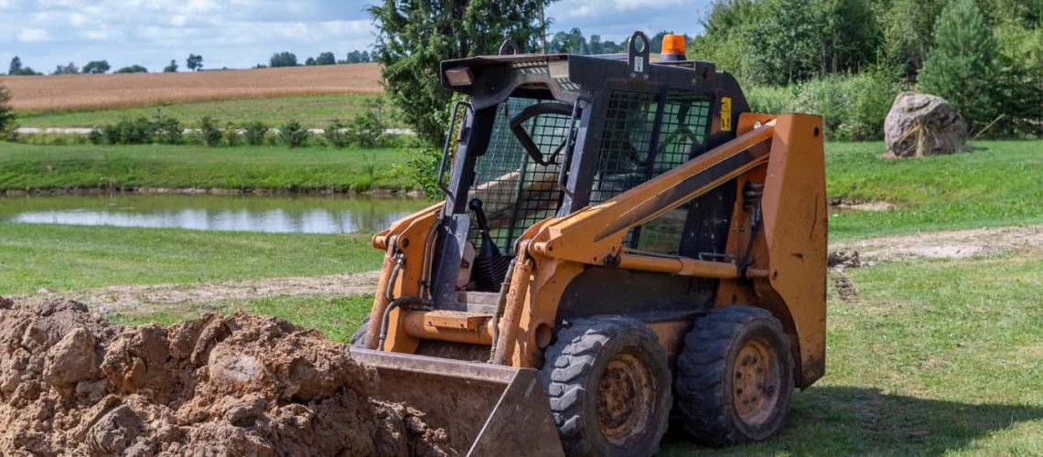 mini excavator being used on rural land