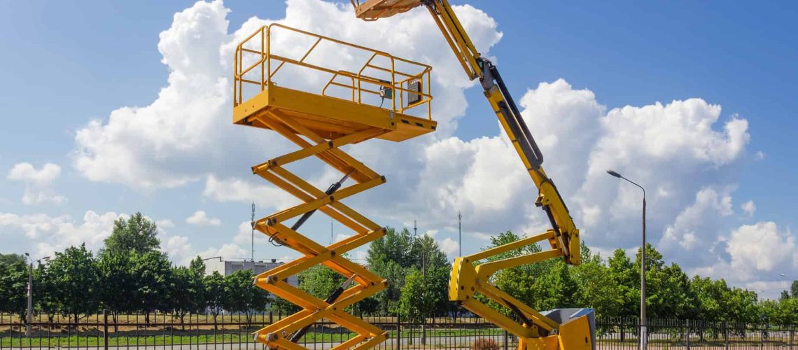 two different types of boom lift rentals next to each other